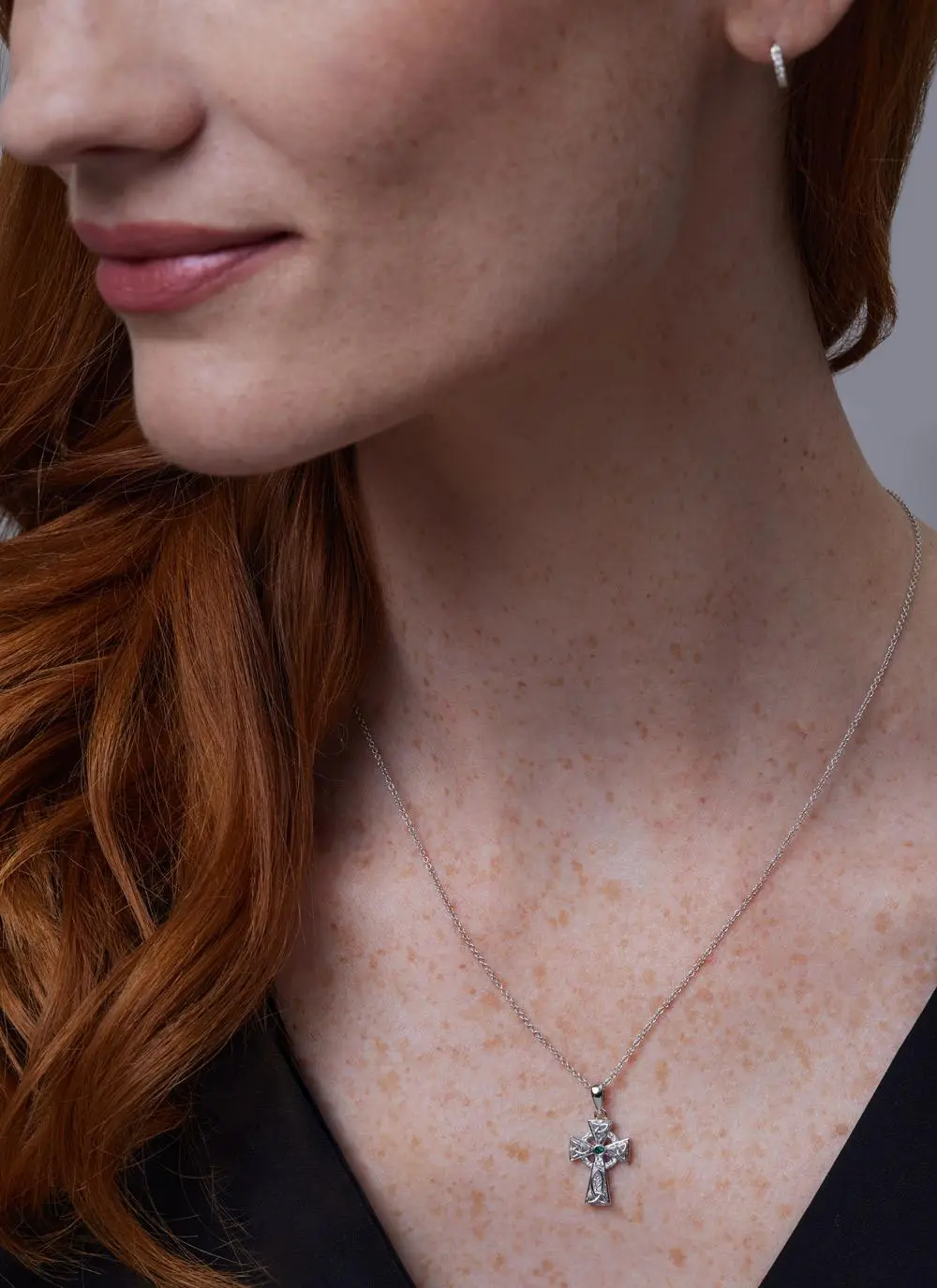 Close up of red haired model wearing Sterling Silver Celtic Trinity Cross With Swarovski Crystals